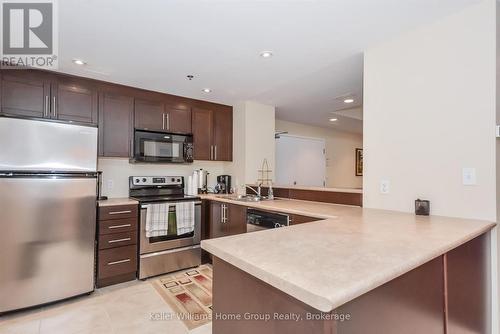 114 - 308 Watson Parkway N, Guelph (Grange Road), ON - Indoor Photo Showing Kitchen With Double Sink
