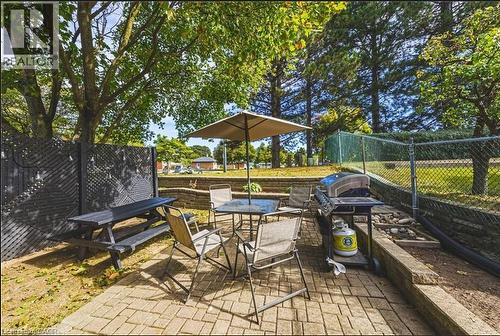 Fenced backyard featuring outdoor dining space and a patio - 267 Erb Street E, Waterloo, ON - Outdoor With Deck Patio Veranda