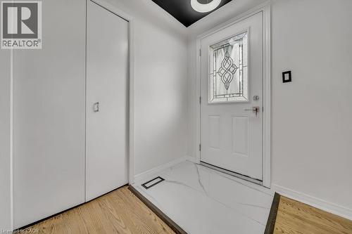 Foyer entrance featuring light wood-type flooring and baseboards - 267 Erb Street E, Waterloo, ON - Indoor Photo Showing Other Room