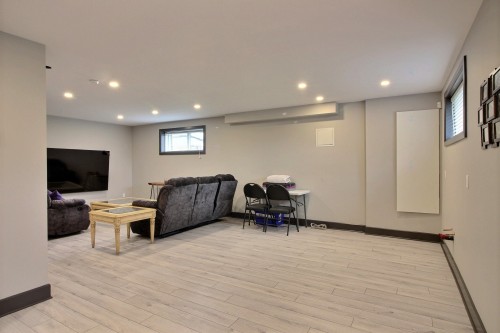 Salle familiale - 30 Rue Élizabeth, Saint-André-D'Argenteuil, QC - Indoor Photo Showing Basement