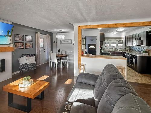 109 Noonan Drive, Brandon, MB - Indoor Photo Showing Living Room With Fireplace