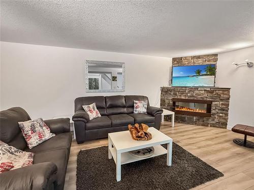109 Noonan Drive, Brandon, MB - Indoor Photo Showing Living Room With Fireplace