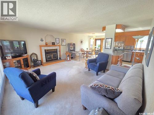 509 Carlyle Avenue, Carlyle, SK - Indoor Photo Showing Living Room With Fireplace