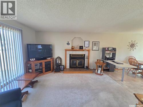 509 Carlyle Avenue, Carlyle, SK - Indoor Photo Showing Living Room With Fireplace