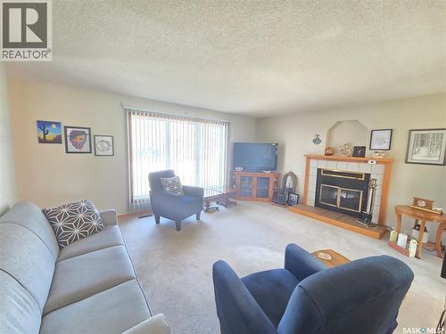 509 Carlyle Avenue, Carlyle, SK - Indoor Photo Showing Living Room With Fireplace