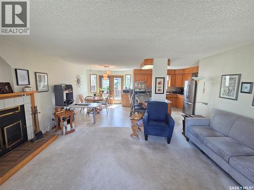 509 Carlyle Avenue, Carlyle, SK - Indoor Photo Showing Living Room With Fireplace