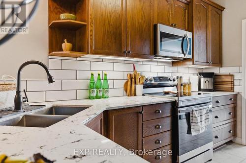 89 Andrews Drive, Mapleton, ON - Indoor Photo Showing Kitchen With Double Sink