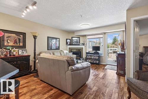 #112 6703 172 St Nw, Edmonton, AB - Indoor Photo Showing Living Room With Fireplace