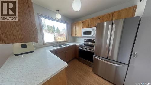 3918 Centennial Drive, Saskatoon, SK - Indoor Photo Showing Kitchen With Double Sink