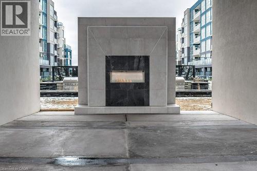 16 Concord Place Unit# 123, Grimsby, ON - Indoor With Fireplace