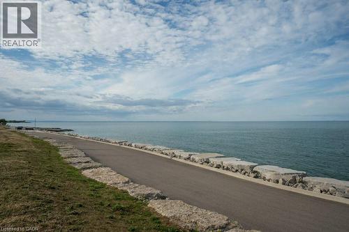 Walk the Grimsby Beach Trail to shops & restaurants - 16 Concord Place Unit# 123, Grimsby, ON - Outdoor With Body Of Water With View