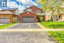 Brick facade residence featuring an attached two-car garage with panel doors - 43 Niska Drive, Waterdown, ON  - Outdoor 