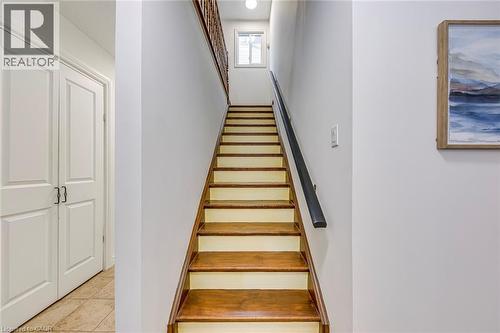 Staircase with wood-finish treads and white risers - 43 Niska Drive, Waterdown, ON - Indoor Photo Showing Other Room