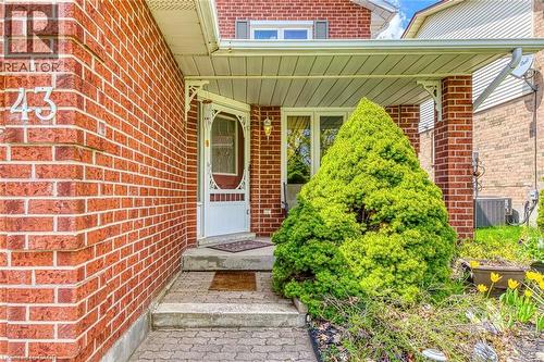Brick exterior featuring an inviting covered porch - 43 Niska Drive, Waterdown, ON - Outdoor