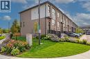 Modern townhome exterior with brick and paneling accents - 720 Grey Street Unit# 34, Brantford, ON  - Outdoor 