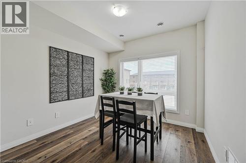 Dining area featuring wood-finish flooring, a large window with blinds, and recessed lighting - 720 Grey Street Unit# 34, Brantford, ON - Indoor Photo Showing Dining Room