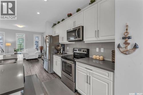 219 Newton Link, Saskatoon, SK - Indoor Photo Showing Kitchen With Stainless Steel Kitchen With Double Sink