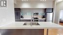 312 235 Evergreen Square, Saskatoon, SK  - Indoor Photo Showing Kitchen With Stainless Steel Kitchen With Double Sink 