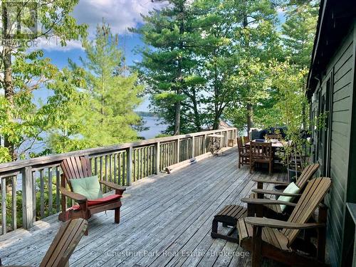 Expansive decking for lounging & dining - 1 Rose Island, Gravenhurst (Morrison), ON - Outdoor With Body Of Water With Deck Patio Veranda With Exterior
