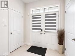 Double entry doors with transom window and integrated privacy blinds - 