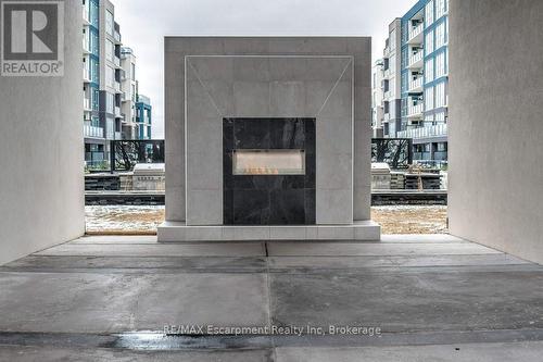123 - 16 Concord Place, Grimsby (Grimsby Beach), ON - Indoor With Fireplace