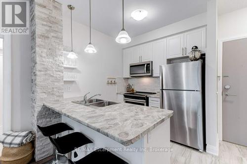 123 - 16 Concord Place, Grimsby (Grimsby Beach), ON - Indoor Photo Showing Kitchen With Double Sink With Upgraded Kitchen