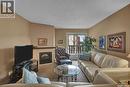 202D1 1121 Mckercher Drive, Saskatoon, SK  - Indoor Photo Showing Living Room With Fireplace 