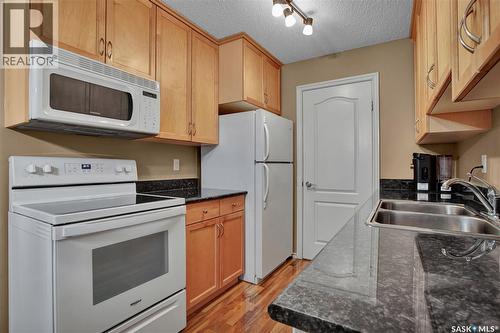 202D1 1121 Mckercher Drive, Saskatoon, SK - Indoor Photo Showing Kitchen With Double Sink