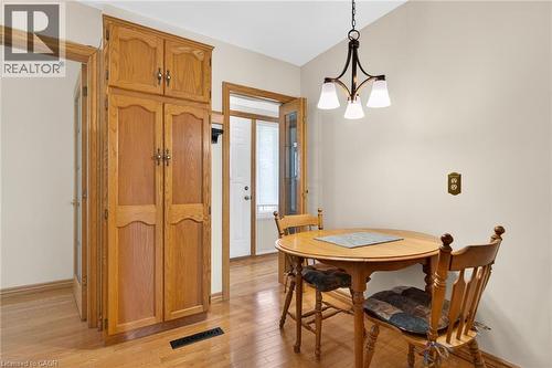 Integrated wood-finish cabinetry providing ample storage - 525 East 16Th Street, Hamilton, ON - Indoor Photo Showing Dining Room