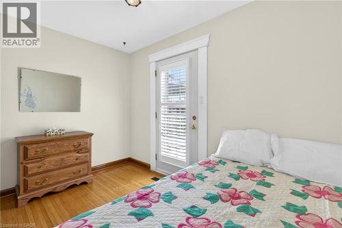 Hardwood flooring throughout, white painted walls, and a white trim package - 525 East 16Th Street, Hamilton, ON - Indoor Photo Showing Bedroom