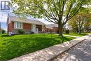 Brick and stone facade residence featuring a front yard with mature landscaping - 525 East 16Th Street, Hamilton, ON  - Outdoor 