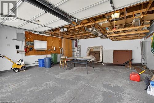 Spacious garage with exposed ceiling joists and a concrete floor - 525 East 16Th Street, Hamilton, ON - Indoor Photo Showing Basement