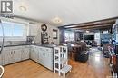 608 Aurora Street, Saskatchewan Beach, SK  - Indoor Photo Showing Kitchen With Fireplace 