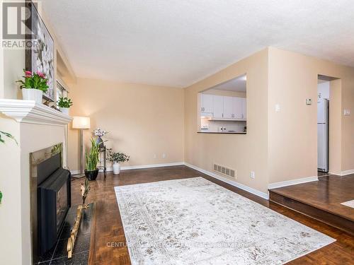 Living room with patio doors to back yard. - 80 - 22C Maple Ridge Crescent, Ottawa, ON - Indoor With Fireplace