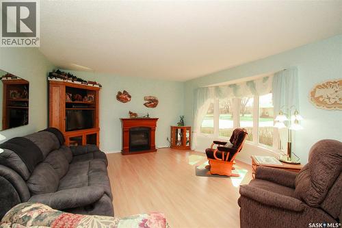 435 3Rd Avenue E, Shaunavon, SK - Indoor Photo Showing Living Room With Fireplace
