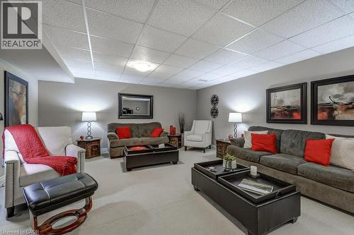 Spacious room featuring light gray walls, light-toned carpeting, and a drop ceiling with recessed lighting - 605 Welland Avenue Unit# 21, St. Catharines, ON - Indoor Photo Showing Living Room