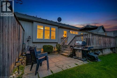 Rear exterior with wood siding and multi-pane windows - 605 Welland Avenue Unit# 21, St. Catharines, ON - Outdoor With Deck Patio Veranda