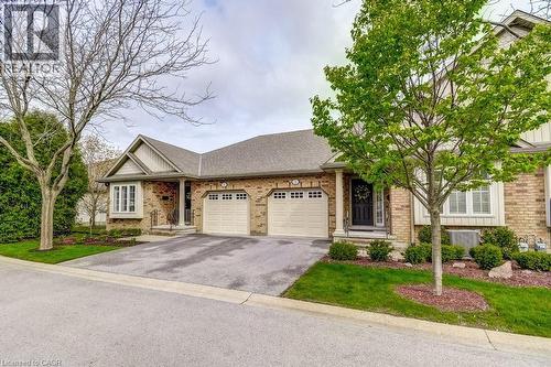 Brick exterior featuring a hip roofline and contrasting siding - 605 Welland Avenue Unit# 21, St. Catharines, ON - Outdoor With Facade