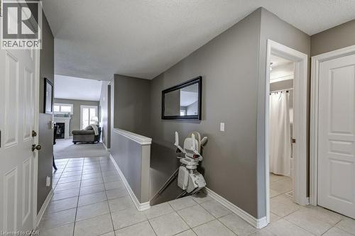 Entryway featuring tile flooring, white baseboards, and a neutral wall color - 605 Welland Avenue Unit# 21, St. Catharines, ON - Indoor Photo Showing Other Room
