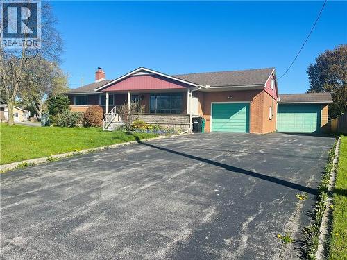 Brick exterior with a prominent red-sided gable - 157 Schweitzer Street, Kitchener, ON - Outdoor