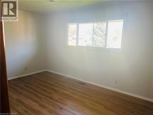 Room featuring wood-finish flooring, white baseboards, and light-colored walls - 157 Schweitzer Street, Kitchener, ON - Indoor Photo Showing Other Room