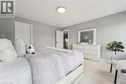 Light gray wall paint complemented by white trim and a neutral carpet - 