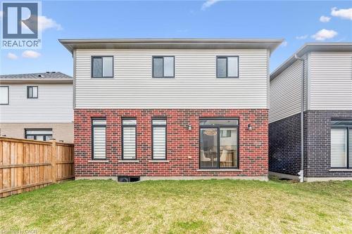 Rear elevation featuring red brick and light siding - 628 Florencedale Crescent, Kitchener, ON 