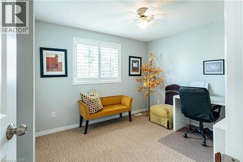 Room featuring light-colored wall paint and textured carpeting - 560 Penny Lane, Waterloo, ON 