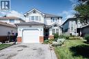 Two-story residence featuring white siding, a single-car garage, and a peaked roofline - 560 Penny Lane, Waterloo, ON 
