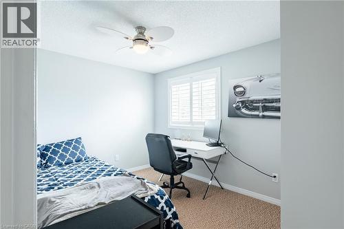 Room featuring neutral-toned carpet flooring and light-colored walls - 560 Penny Lane, Waterloo, ON 