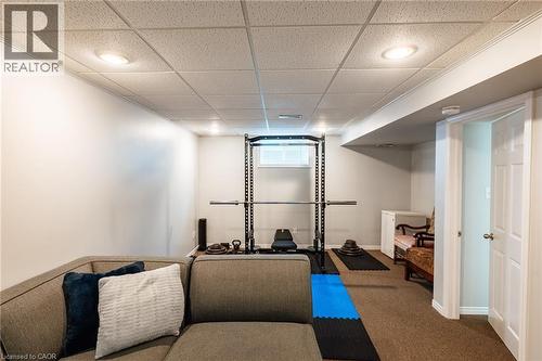 Finished lower level featuring recessed lighting, a drop ceiling, and neutral carpeting - 560 Penny Lane, Waterloo, ON 