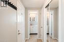 Inviting entryway featuring tile flooring and a bright, neutral color palette - 560 Penny Lane, Waterloo, ON 