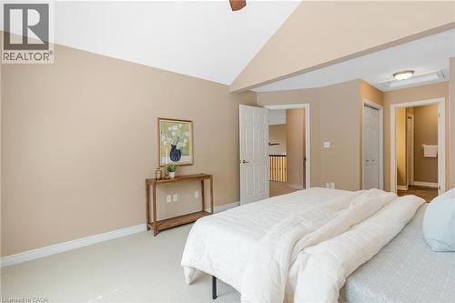 Carpeted bedroom featuring vaulted ceilings, neutral wall tones, and white trim - 227 Chestnut Hill Crescent, Kitchener, ON - Indoor Photo Showing Bedroom
