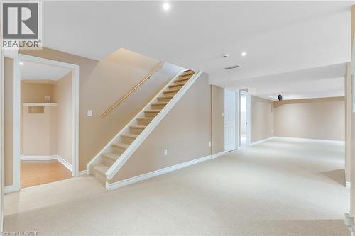 Spacious lower level featuring light-toned carpeting, neutral wall paint, and recessed lighting - 227 Chestnut Hill Crescent, Kitchener, ON - Indoor Photo Showing Other Room